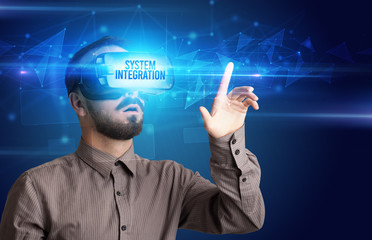 Businessman looking through Virtual Reality glasses with SYSTEM INTEGRATION inscription, cyber security concept