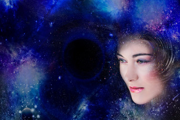 Woman looks into the blue space abyss