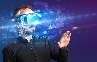 Businessman looking through Virtual Reality glasses with DIGITAL inscription, innovative technology concept