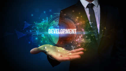 Elegant hand holding DEVELOPMENT inscription, digital technology concept