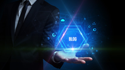 Man hand holding BLOG inscription, social media concept