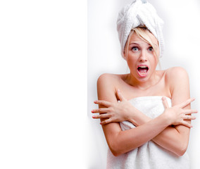 young pretty blond smiling woman with white towel on head posing cheerful on white background, lifestyle people concept