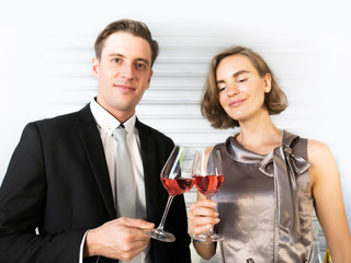 Caucasian lover couple handsome husband and beautiful wife clink glasses of red champagne beverage celebrated anniversary dinner sweet romantic moment together on Valentine's special day in home