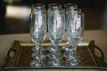 Glasses for champagne stand on the table