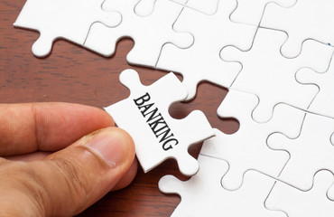 Placing missing a piece of puzzle with banking word