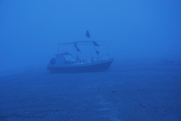 A ship inside the fog, Caorle, Veneto, Italy