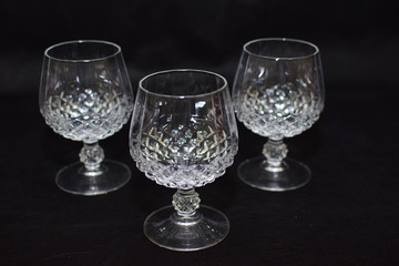 Mock up  design set of elegant and traditional drink ware / drinking glass & Jar for wine or juice, transparent isolated on black background template for branding identity and company logo isolated