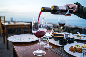 pouring wine with scenery