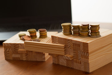 wooden building bricks arranged to symbolize gender gap, discrimination, unequal pay, inequality, or similar business/social Topics with one brick left blank for respective description