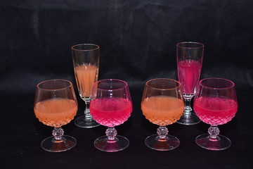 Mock up  design set of elegant and traditional drink ware / drinking glass & Jar for wine or juice, transparent isolated on black background template for branding identity and company logo isolated