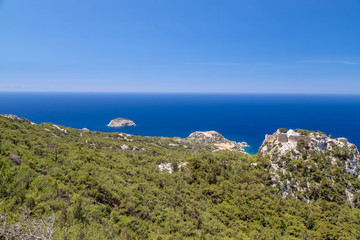 Fototapeta na wymiar Scenic view at landscape and rocky coastline near Monolithos on Greek island Rhodes with the aegaen sea in the background