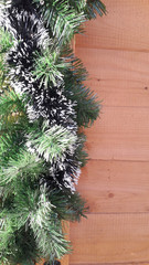 New year, Christmas decoration with green evergreen branches on wooden background