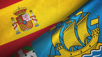 Spain and Saint Pierre and Miquelon two flags textile cloth, fabric texture