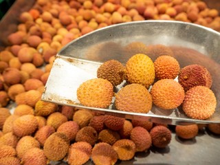 lychees in a silver scoop