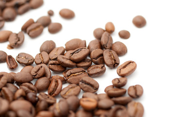 Close up shot of coffee beans on white background
