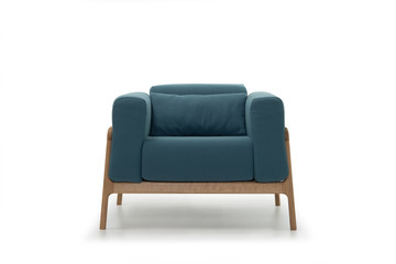 Brand new turquoise armchair isolated on white background in studio