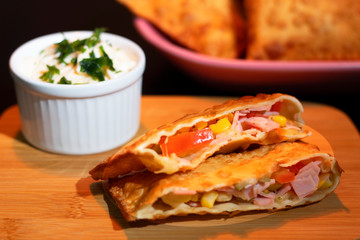 Ham and mozzarella pastry with tomato corn and basil