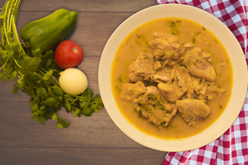 Braised Fish Fillet or Stew fish. Cooked fish made with tomatoes, onions, peppers and coriander. Wood Background.