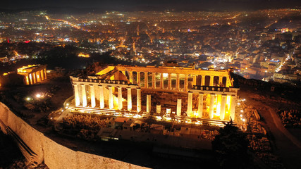 Aerial drone night shot of iconic masterpiece of ancient world the Parthenon, Acropolis hill, Athens, Greece