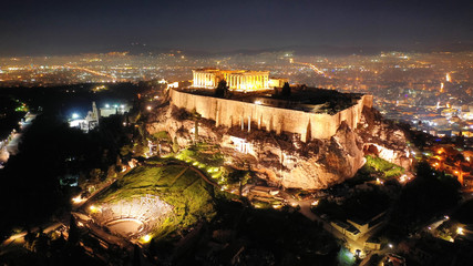 Aerial drone night shot of iconic masterpiece of ancient world the Parthenon, Acropolis hill, Athens, Greece