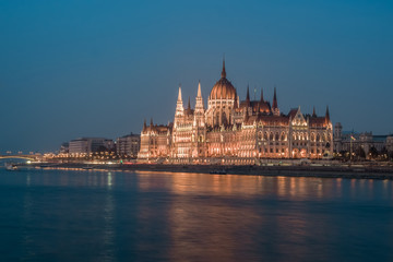 Obraz na płótnie Canvas Hungarian Parliament building and Danube River in the Budapest city in the evening. A sample of neo-gothic architecture.
