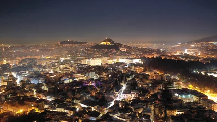 Poster Aerial drone night shot of illuminated cityscape of Athens, Attica, Greece © aerial-drone