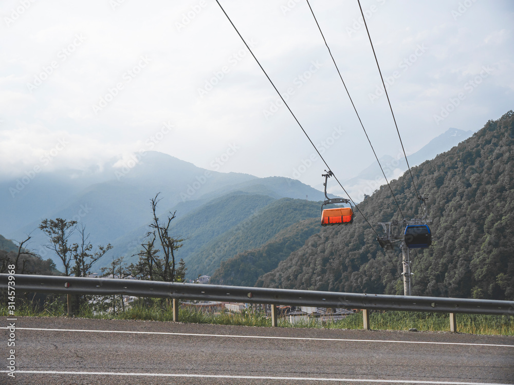 Wall mural mountain road and cable car in caucasus mountains. sochi, russia