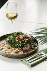 Gourmet meat meals assortment flat lay. Top view on restaurant table with menu of tasty grilled snacks. Concept for restaurant menu.