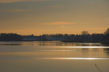 Yellow landscape with lake water trees plants sunset water view reflections, beautiful sky clouds calm leisure