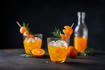 Alcoholic cocktail with mandarins