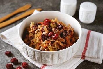 Braised cabbage with cranberries, onions and carrots. Traditional Russian food.
