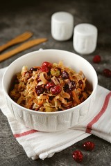 Braised cabbage with cranberries, onions and carrots. Traditional Russian food.