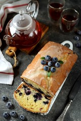 Delicious homemade cake with blueberries in lemon glaze. Homemade baking. Top view. 