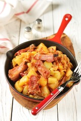 Stewed potatoes with cabbage, carrots, onions, tomato sauce and smoked ribs.