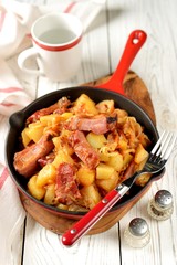 Stewed potatoes with cabbage, carrots, onions, tomato sauce and smoked ribs.