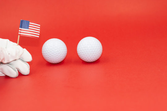 Golfer Is Holding Flag Of America On Red Background