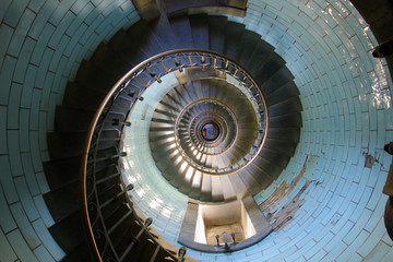 Looking down the spiral staircase inside the Eckmuhl lighthouse in Brittany, France