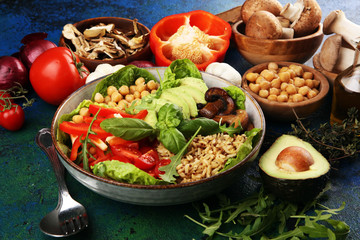 Quinoa and spicy chickpea vegetable vegetarian buddha bowl. Healthy food concept with tomato