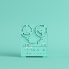 Reel to reel type recorder on bright green background in pastel colors. Minimalism concept