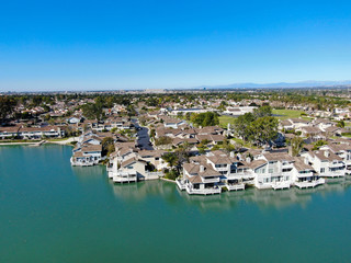Aerial view of North Lake surrounded by residential neighborhood during blue sky day in Irvine,...