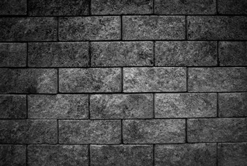 black stone blocks background. Stones texture.Black wall.