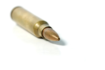 macro shoot of 5.56 caliber bullet on a white isolated background