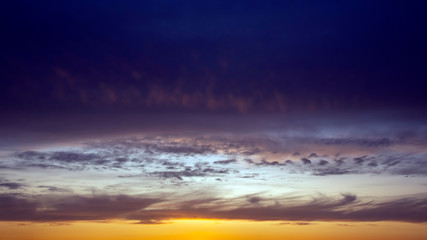 bright-colored and contrasting clouds of the evening sky.