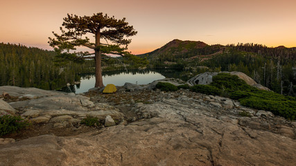 Sunrise at Sierra Nevadas back country near Lake Tahoe, featuring a yellow igloo tent
