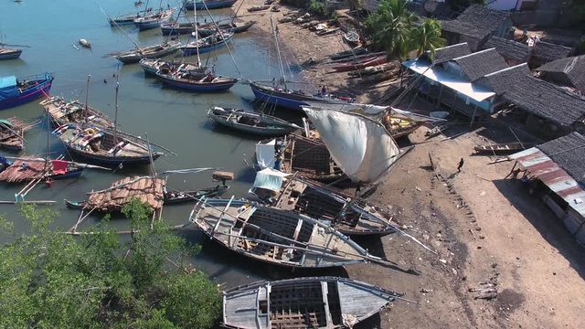 Traditional Pirogue Wooden Sail Boat docked in Madagascar. Aerial of Village Harbour in Nosy Be.
