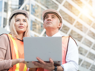 Chief Engineer, Chief Architect female and Executive Investor businessman View Report Construction...