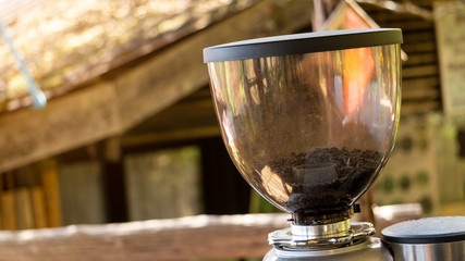 Coffee beans in the blender jar blurred background