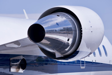 A personal jet against a blue sky