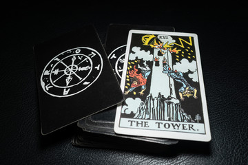 Ubonratchathani,Thailand, December 19 : View of tarot card name The Tower on the table. Dark tone, on December 19, 2019, Ubonratchathani, Thailand.