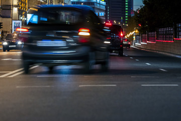 Fototapeta na wymiar car traffic at city road during rush hours. blurred car lights. motion blur